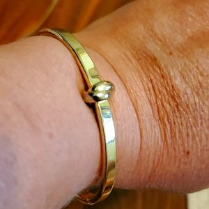 Gold toned clamper bracelet